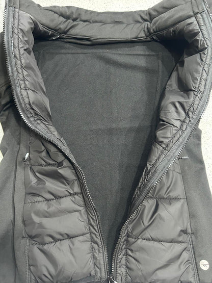 Hi-Tec branded black women's hybrid softshell and quilted puffer jacket